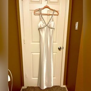 White, formal dress with beaded straps.